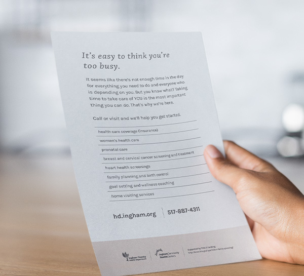 Person looking at handout for women's health
