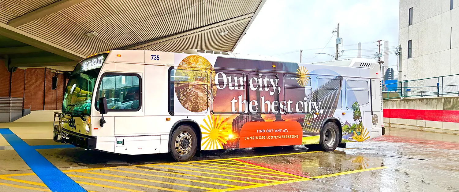 CATA bus parked in the station with advertising on side