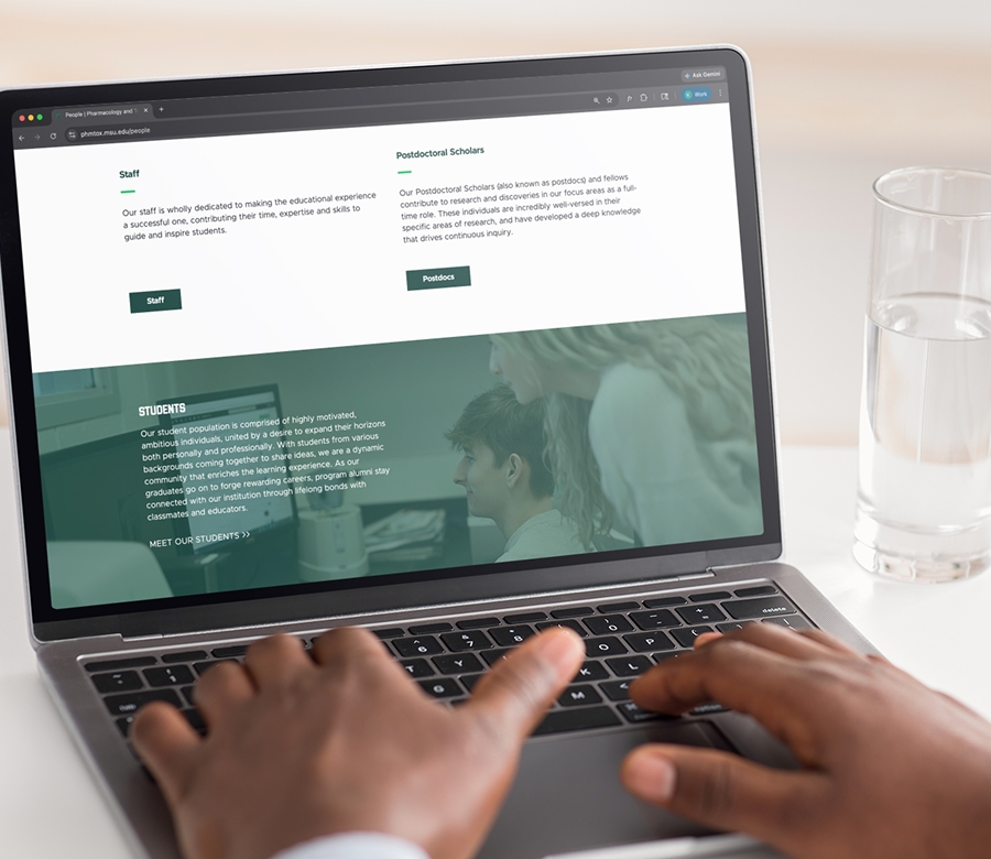 Laptop displaying the MSU Department of Pharmacology and Toxicology website