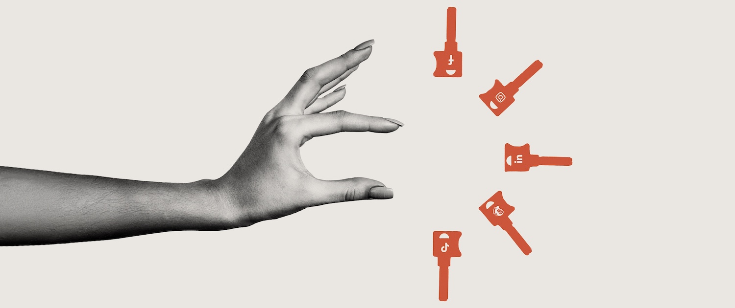 A black and white hand reaches toward five red illustrated keys. 
