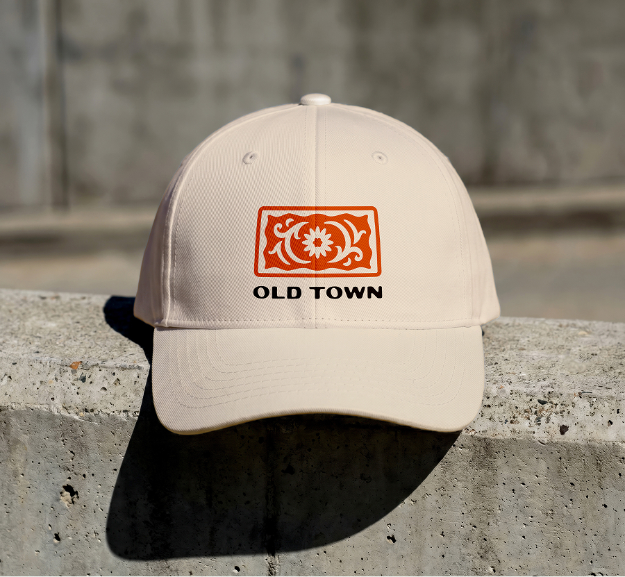 Beige dad-hat featuring the Old Town logo in orange.