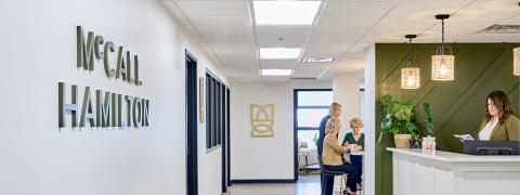 Women of McCall Hamilton working in boutique branded office.