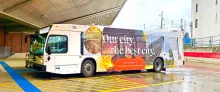 CATA bus parked in the station with advertising on side